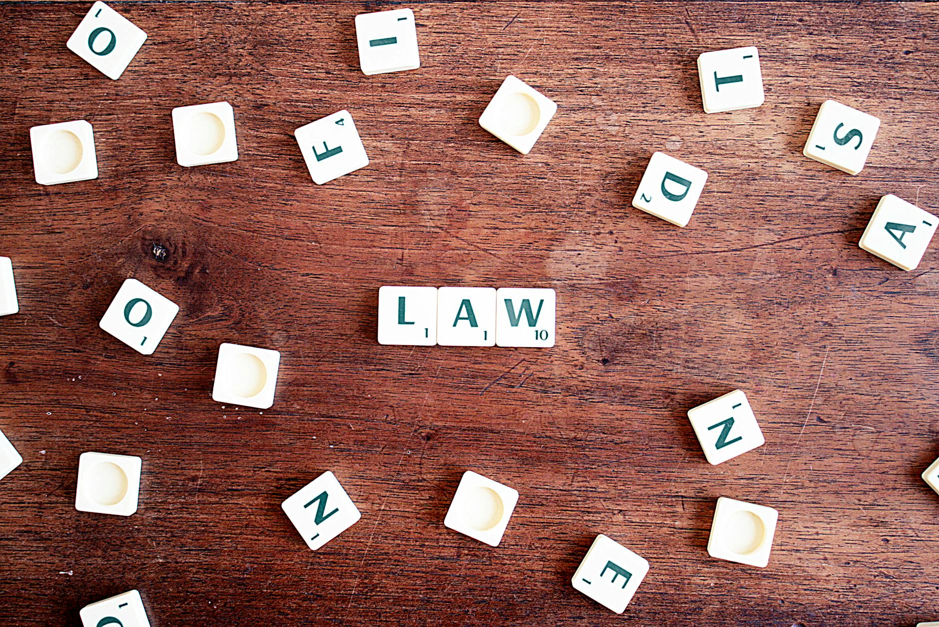 Law tiles on a wooden surface